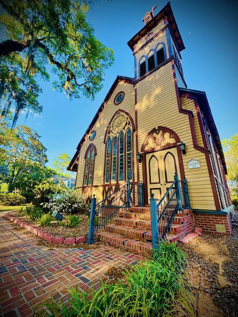 Historic wooden church with brick steps in Jefferson County